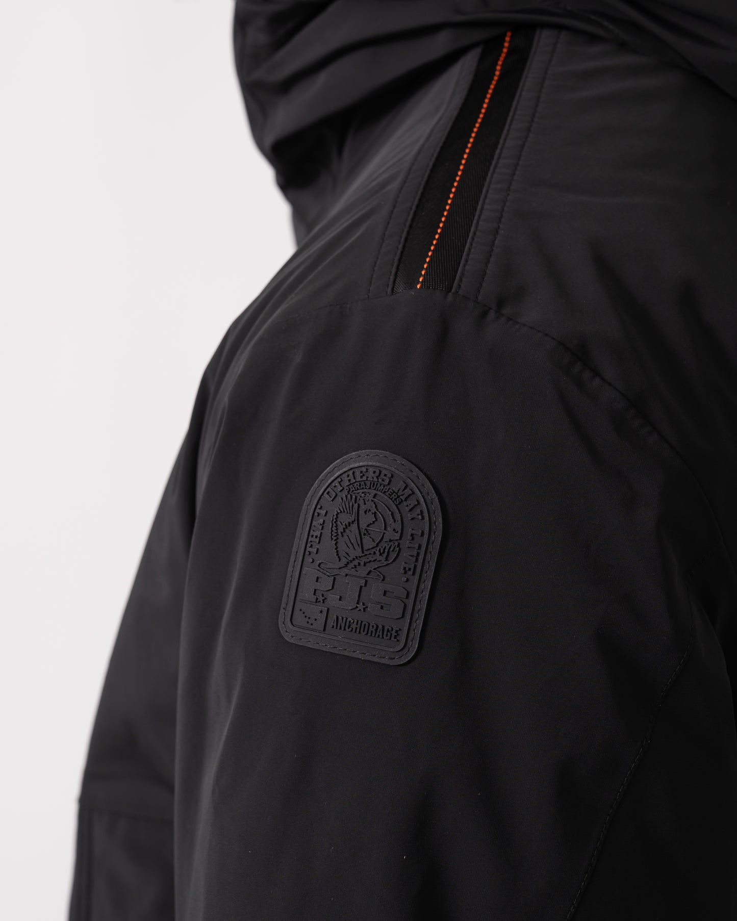 logo detail of a Parajumpers Easy Mens Hooded Padded Coat in Black