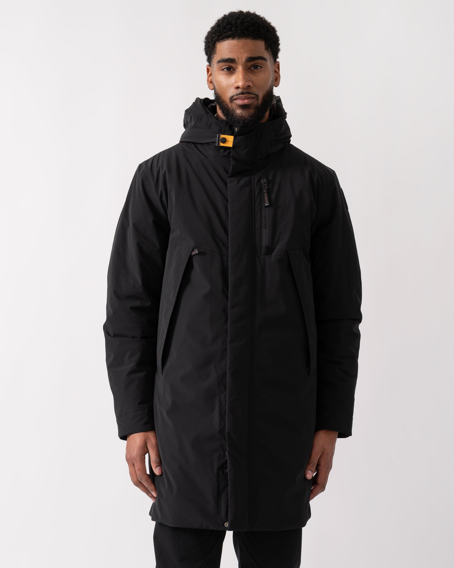 mid shot of a model wearing a Parajumpers Easy Mens Hooded Padded Coat in Black