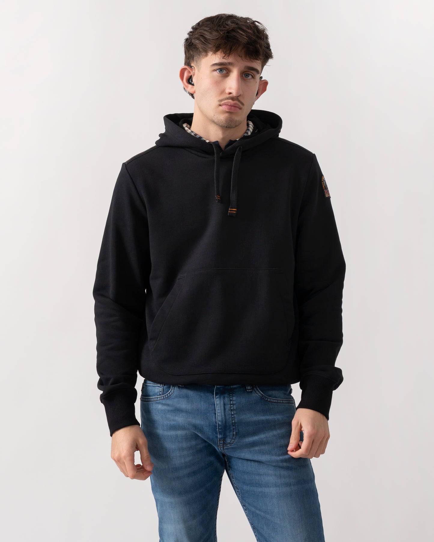 studio shot of a model wearing a Parajumpers Everest Mens Pullover Hoodie in Black 541