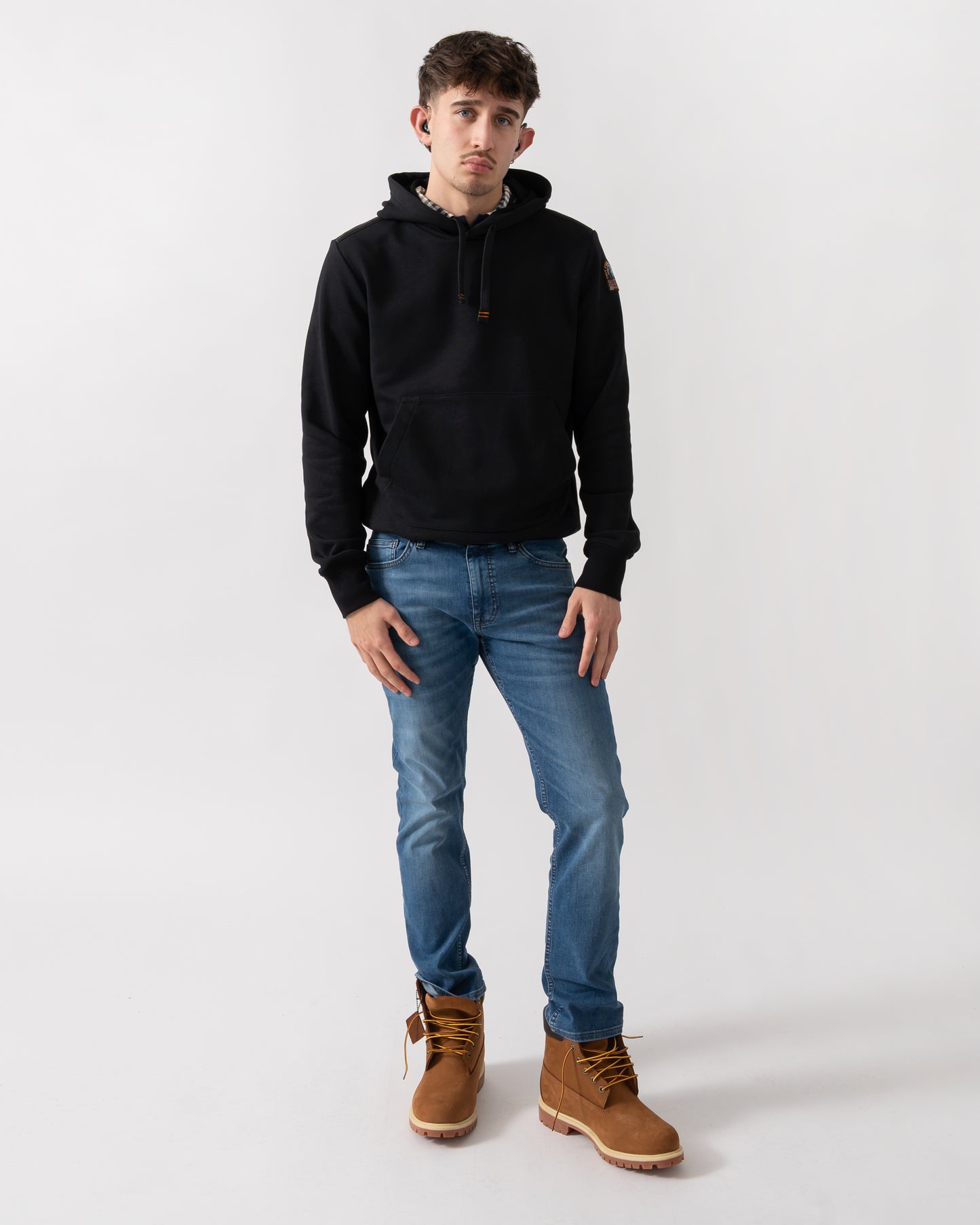 full length shot of a model wearing a Parajumpers Everest Mens Pullover Hoodie in Black 541