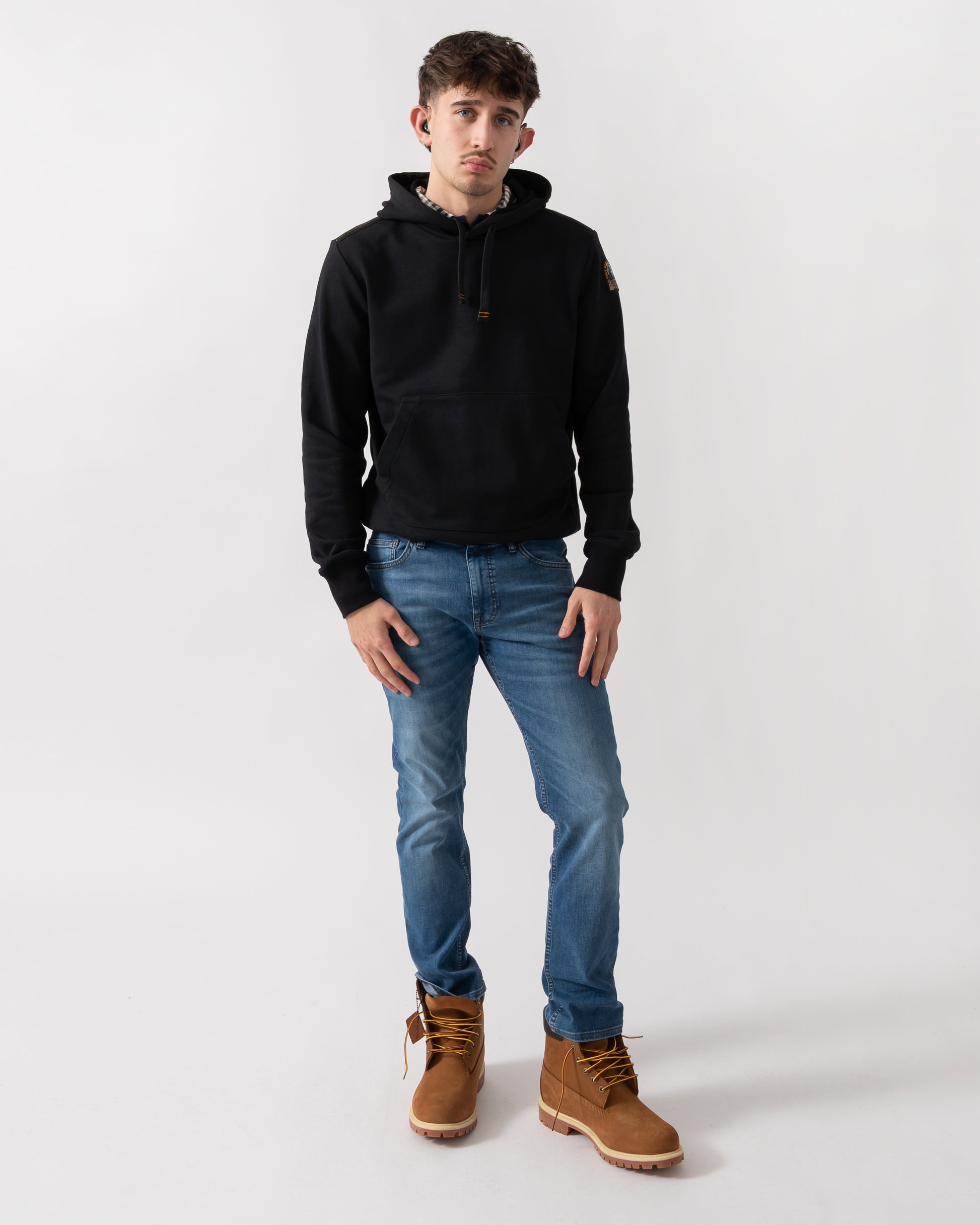 full length shot of a model wearing a Parajumpers Everest Mens Pullover Hoodie in Black 541
