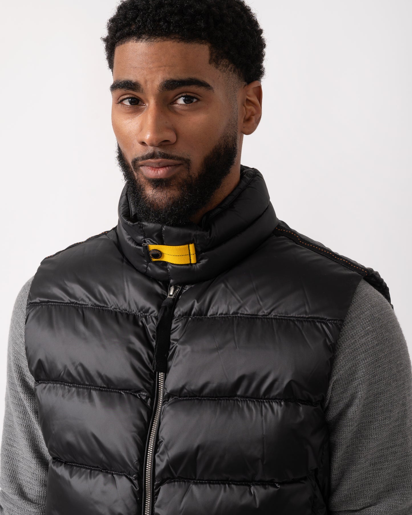 close up shot of a model wearing a Parajumpers Jeordie Mens Down Vest in Black