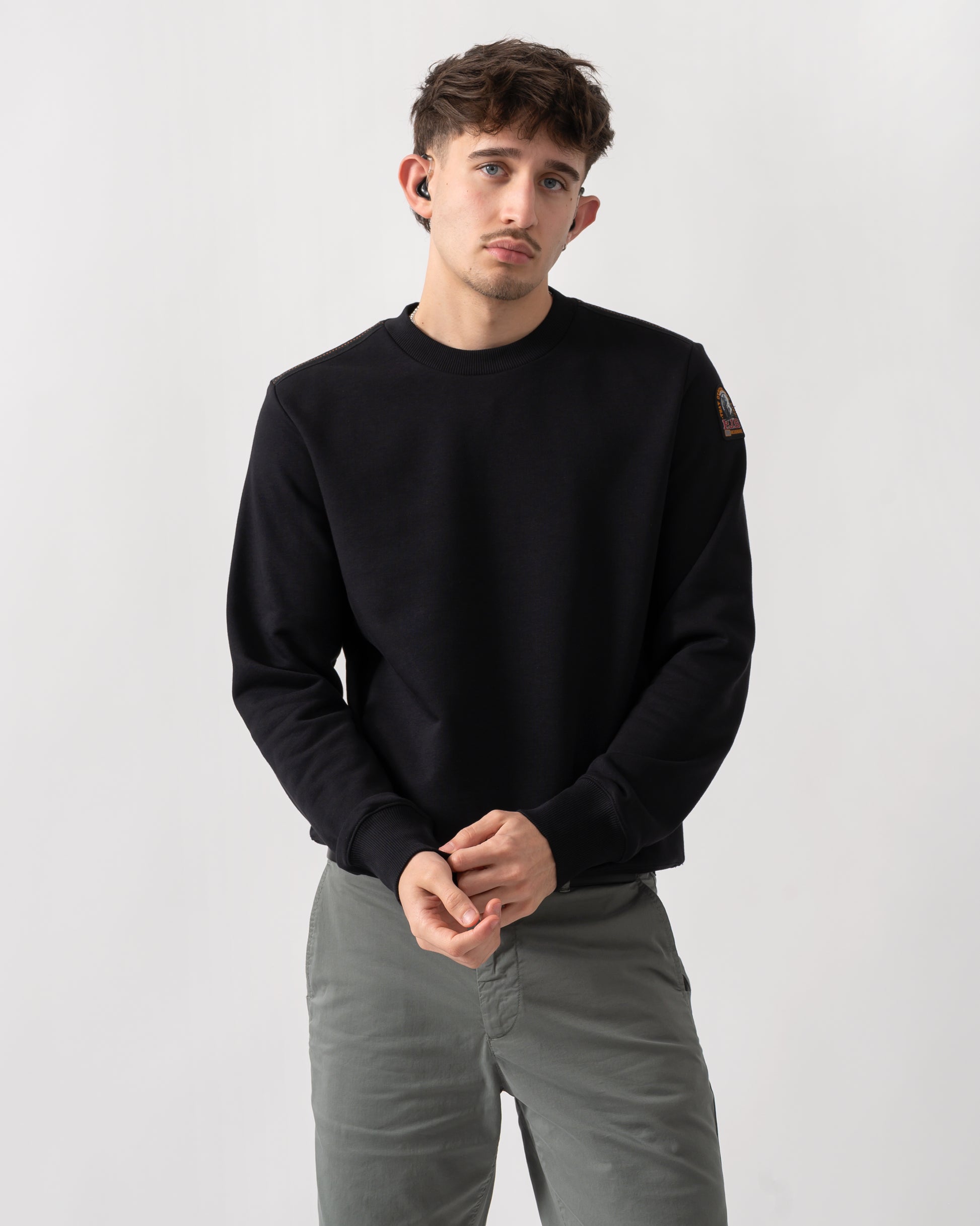 studio shot of a model wearing a Parajumpers K2 Crew Neck Mens Sweatshirt in Black 541