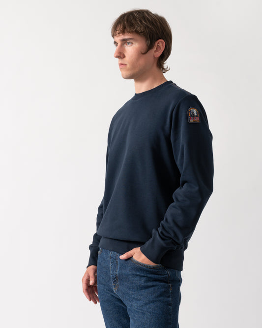 model wearing a Parajumpers K2 Crew Neck Mens Sweatshirt in Blue Navy 316