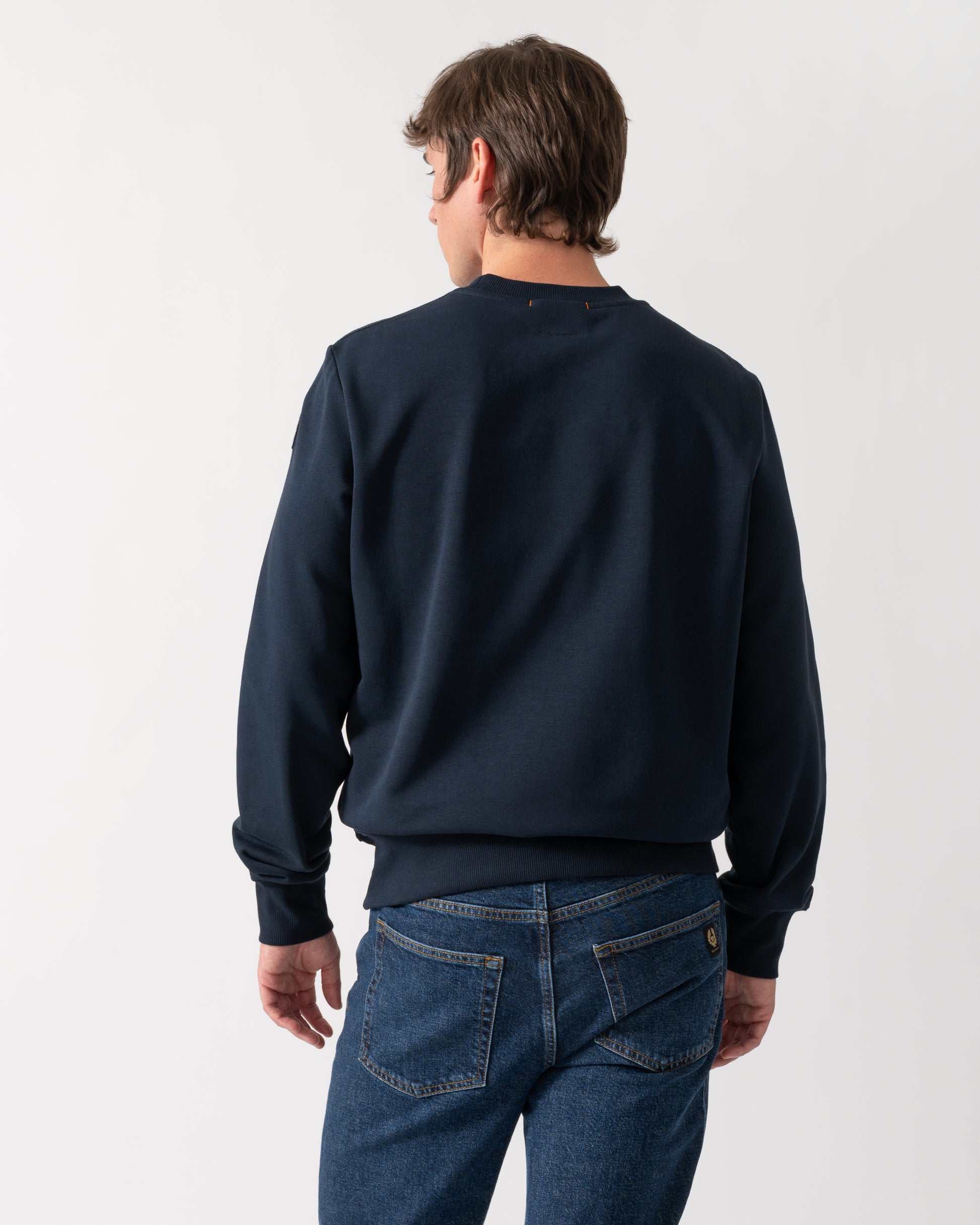back shot of a model wearing a Parajumpers K2 Crew Neck Mens Sweatshirt in Blue Navy 316