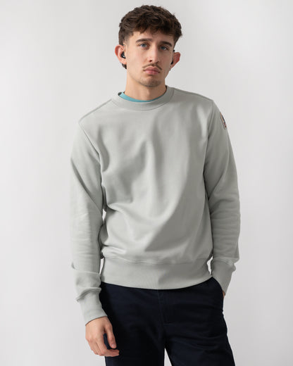 studio shot of a model wearing a Parajumpers K2 Crew Neck Mens Sweatshirt in Fresh Grey 271