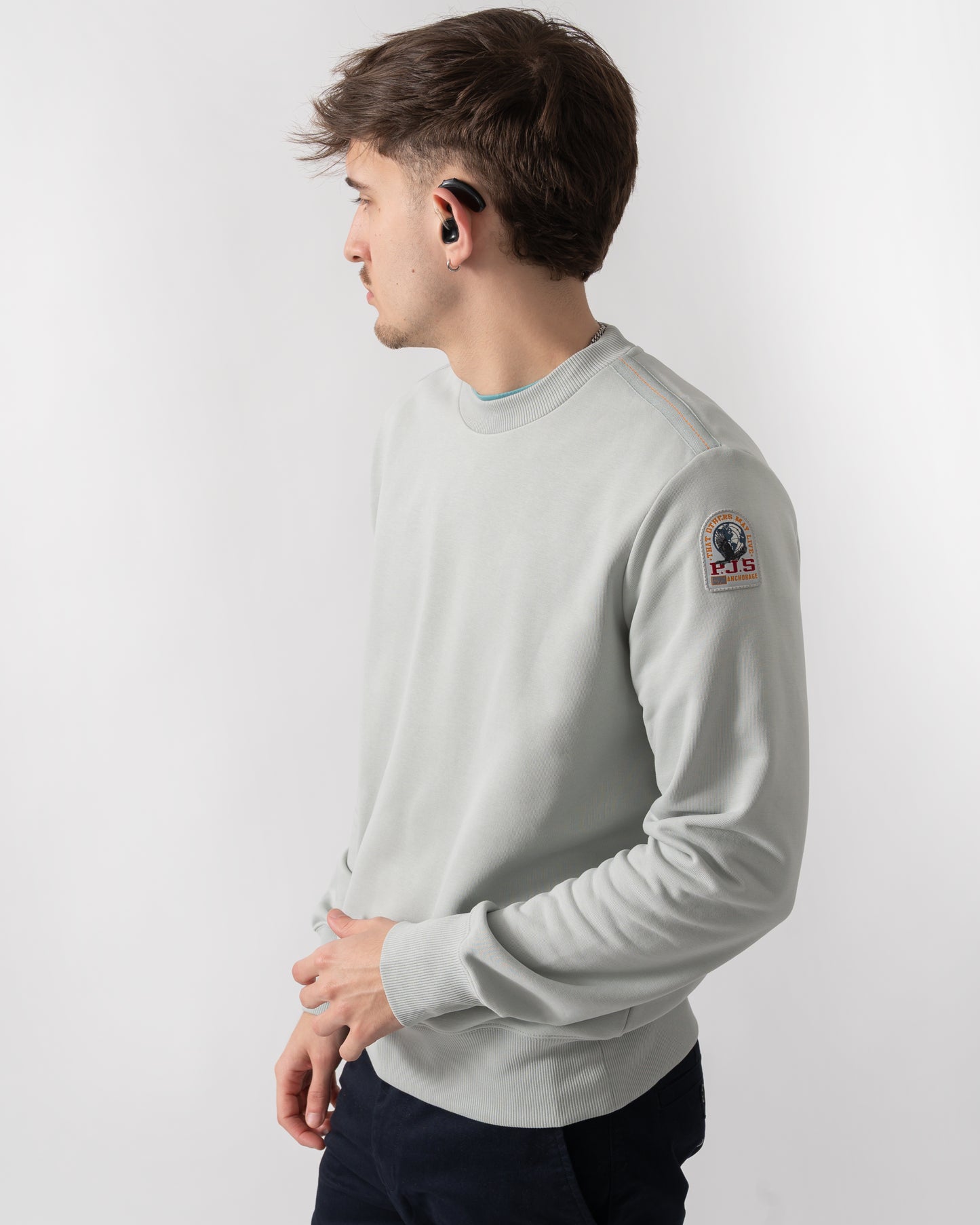 detail shot of a model wearing a Parajumpers K2 Crew Neck Mens Sweatshirt in Fresh Grey 271