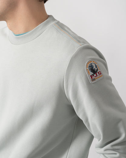 logo shot of a model wearing a Parajumpers K2 Crew Neck Mens Sweatshirt in Fresh Grey 271