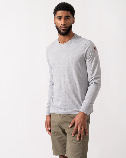 model wearing a Parajumpers Kip Mens Long Sleeve T-Shirt in Ash Grey Melange