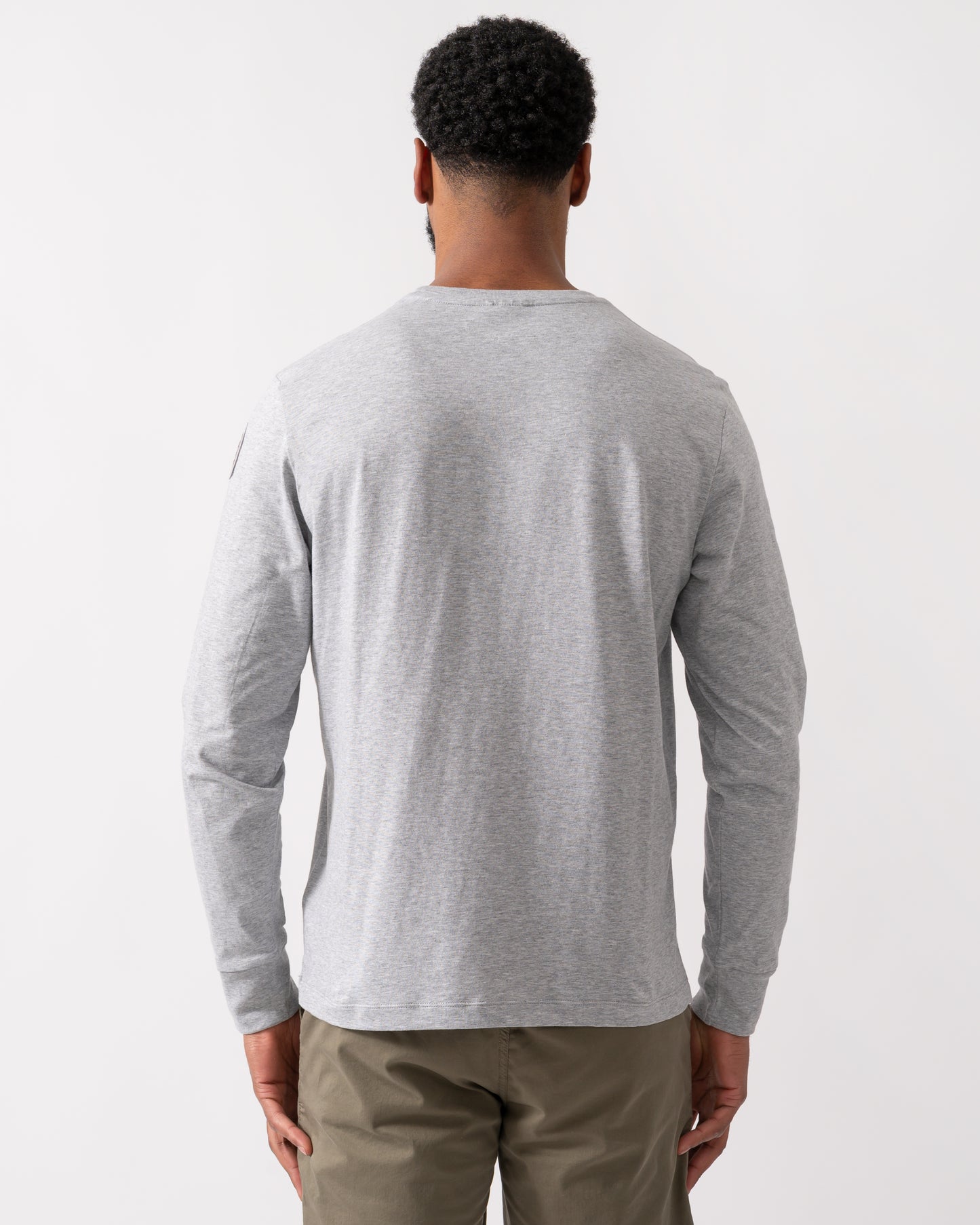 back shot of a model wearing a Parajumpers Kip Mens Long Sleeve T-Shirt in Ash Grey Melange