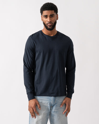 model wearing a Parajumpers Kip Mens Long Sleeve T-Shirt in Blue Navy