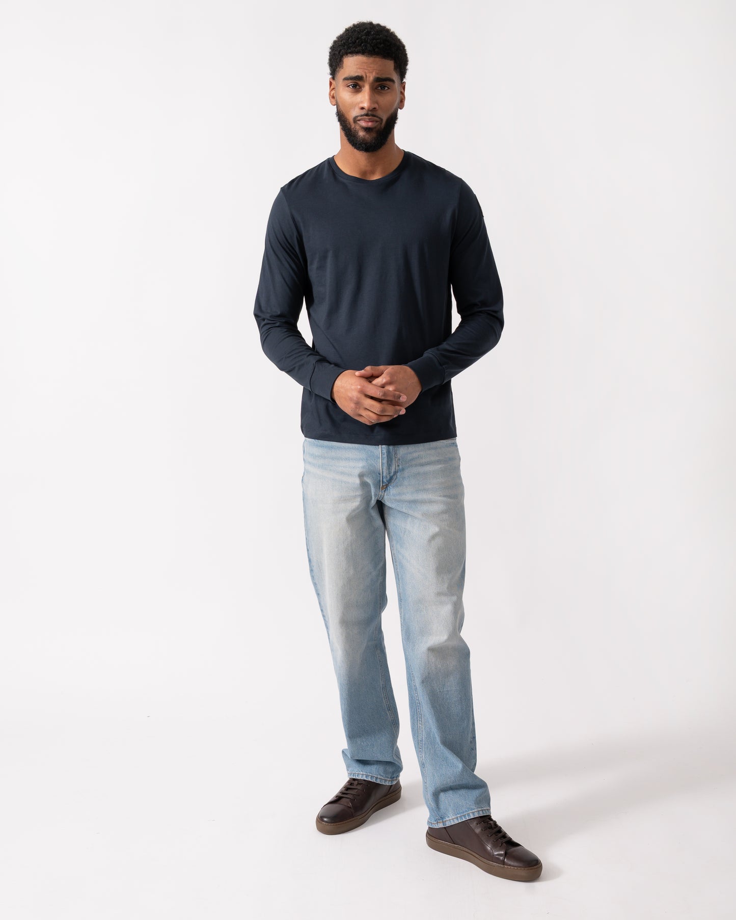 full length of a model wearing a Parajumpers Kip Mens Long Sleeve T-Shirt in Blue Navy