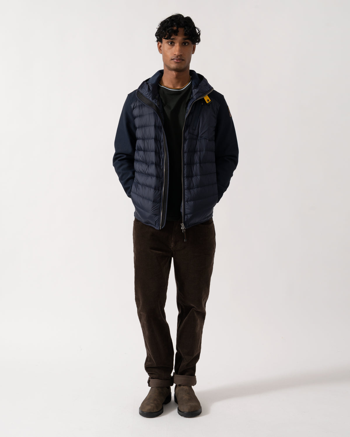 full length Studio photograph of a model wearing a Parajumpers Nolan Mens Hybrid Hooded Jacket in Blue Navy 316