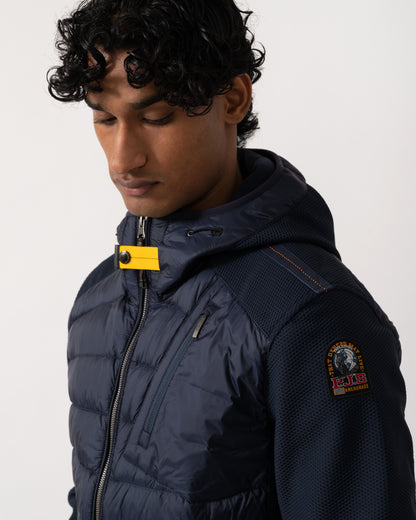 close up Studio photograph of a model wearing a Parajumpers Nolan Mens Hybrid Hooded Jacket in Blue Navy 316