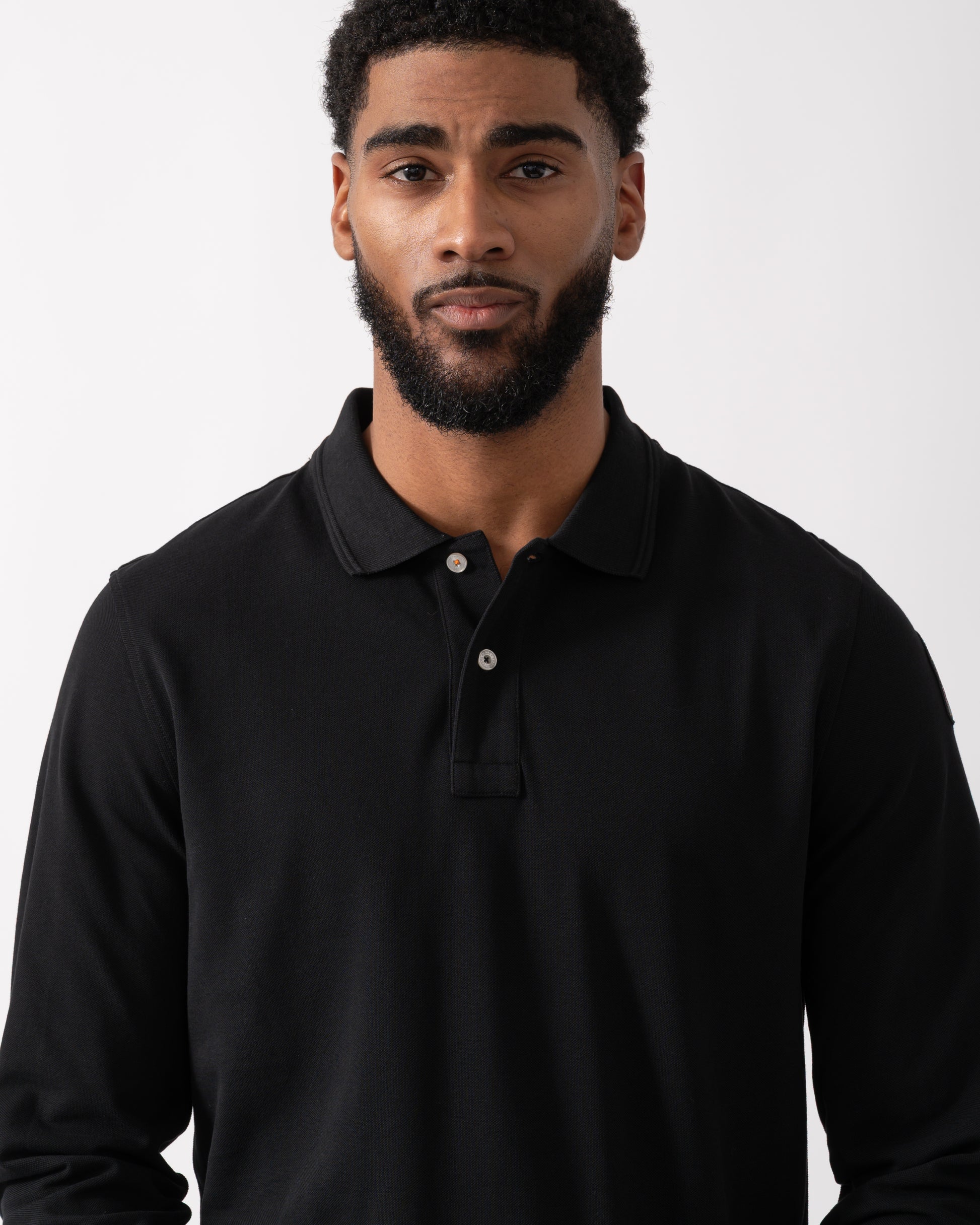 detail shot of a Model wearing a Parajumpers Oberon Polo Mens Polo in Black