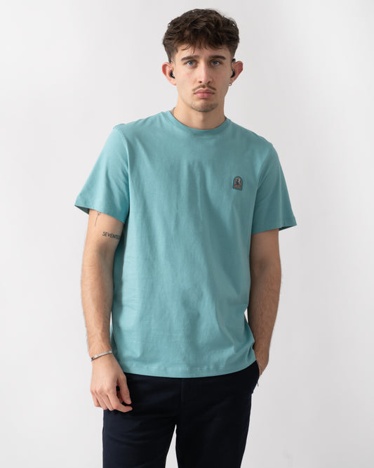 studio shot of a model wearing a Parajumpers Patch Mens T-Shirt in Aqua 522