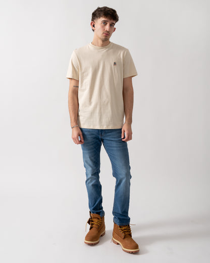 full length shot of a model wearing a Parajumpers Patch Mens T-Shirt in Bone 266