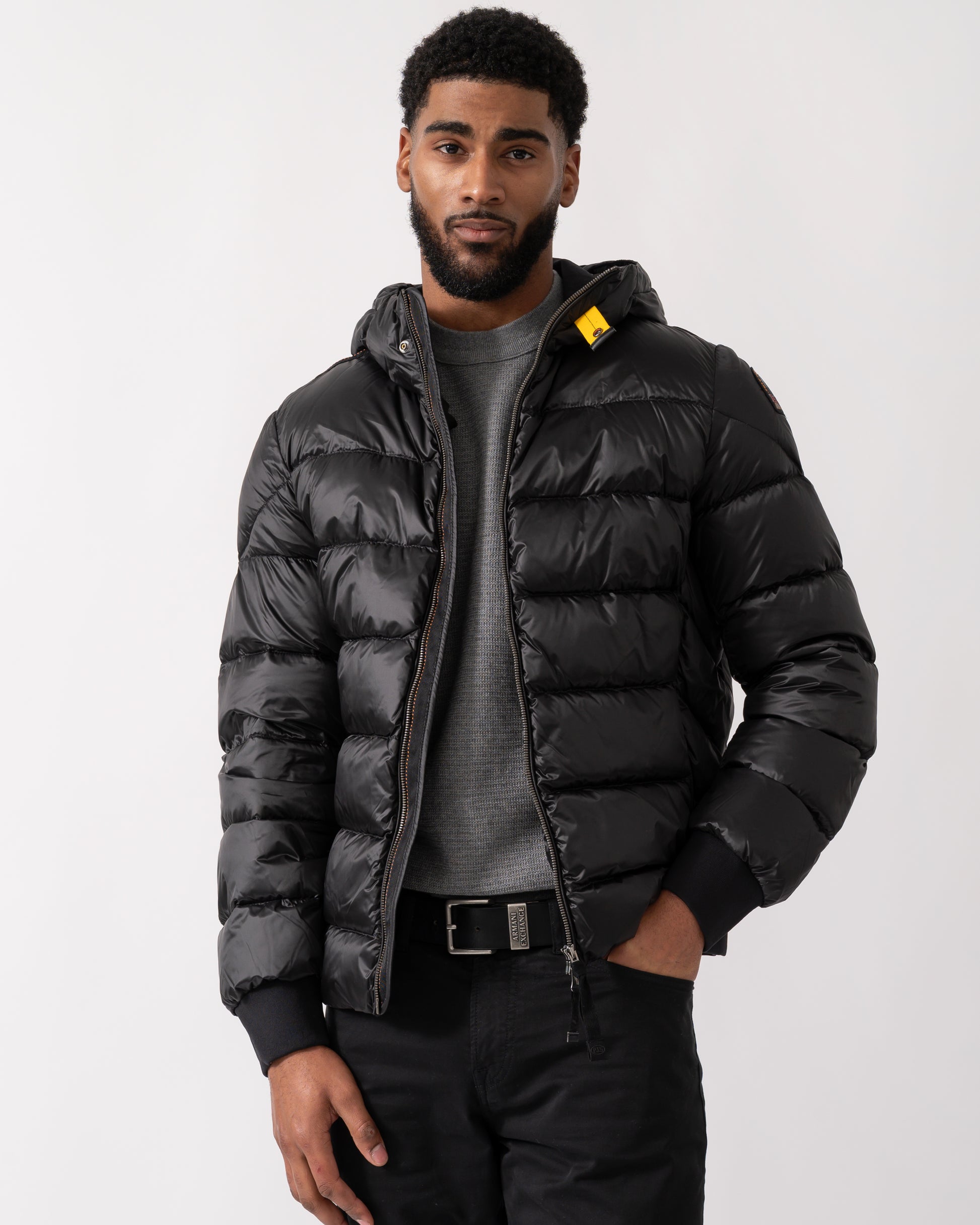 model wearing a Parajumpers Pharrell Mens Hooded Down Bomber in Black