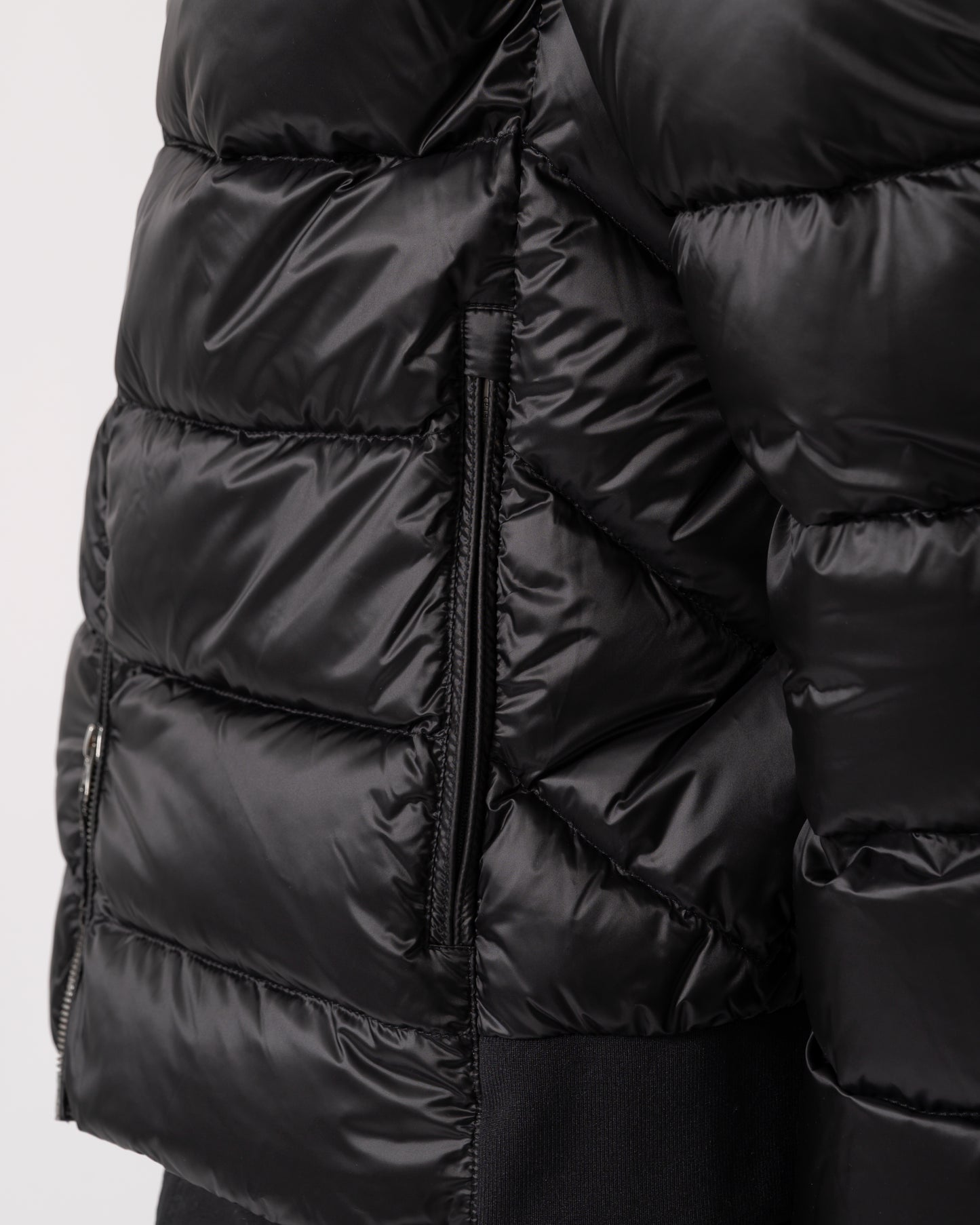 detail of a Parajumpers Pharrell Mens Hooded Down Bomber in Black
