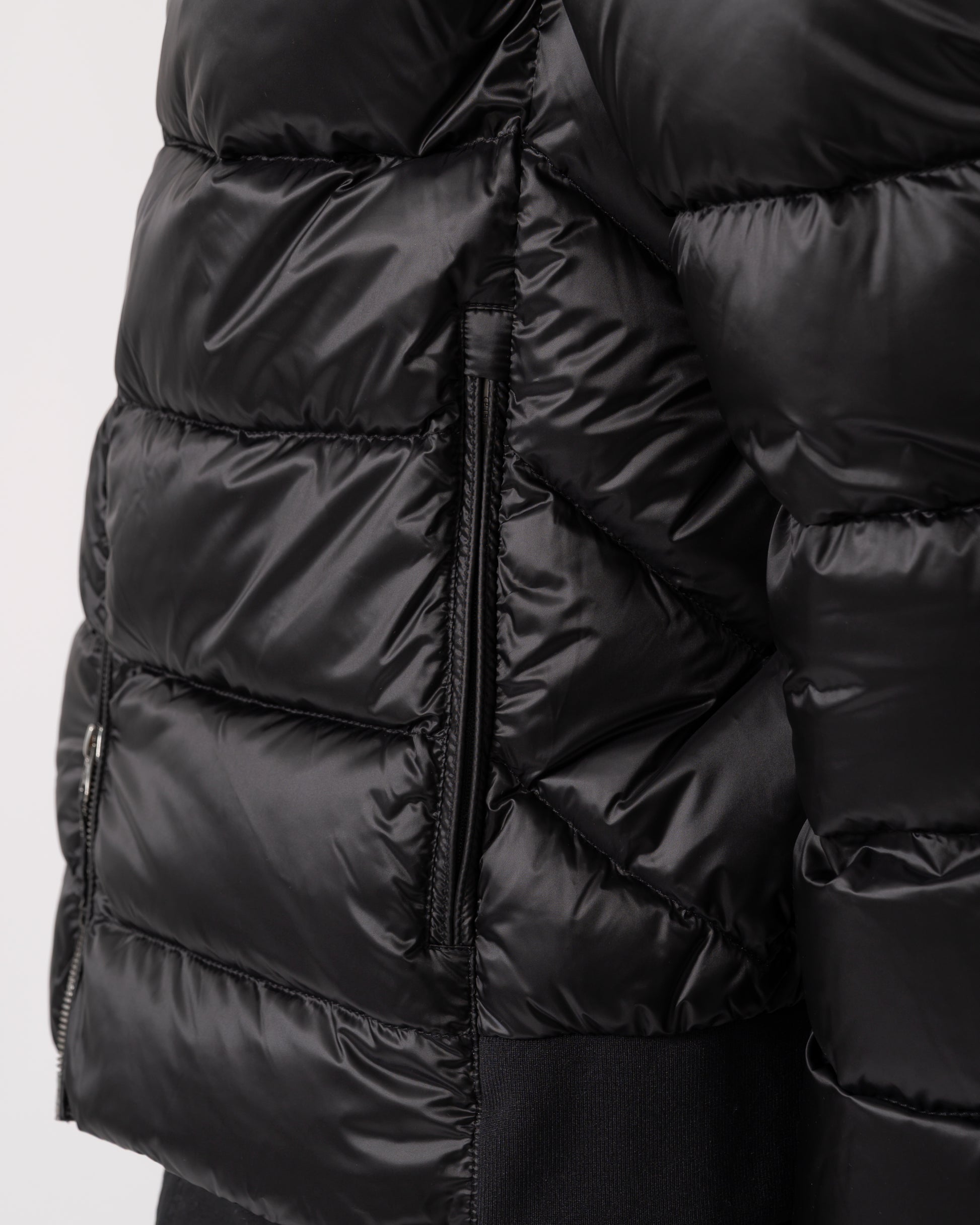 detail of a Parajumpers Pharrell Mens Hooded Down Bomber in Black
