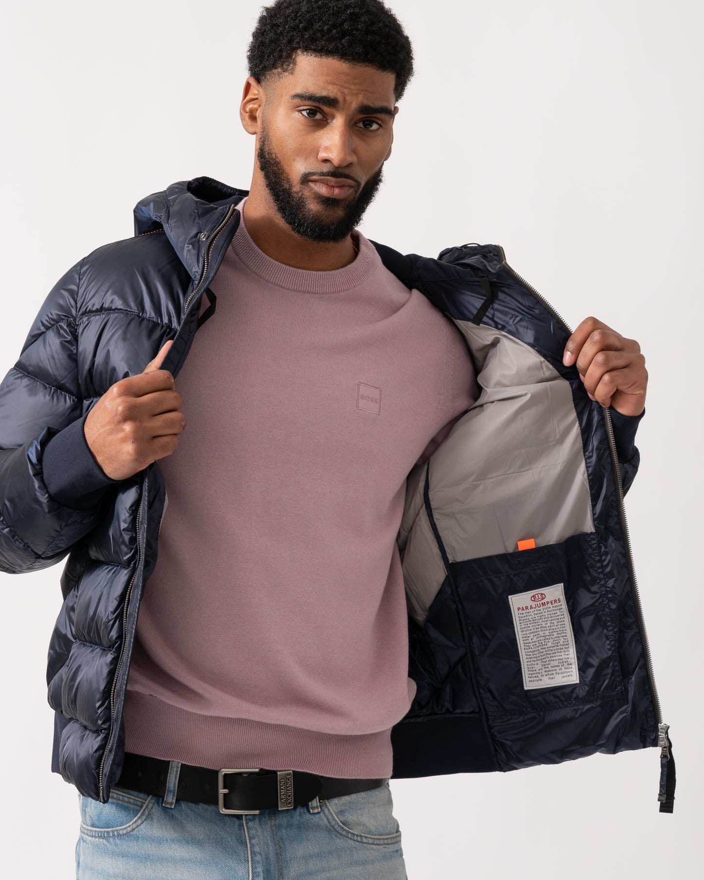 lining detail of a model wearing a Parajumpers Pharrell Mens Hooded Down Bomber in Blue Navy