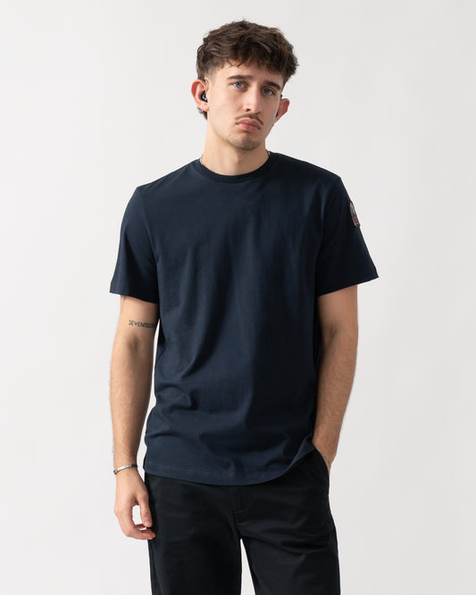 Studio shot of a model wearing a Parajumpers Shispare Mens T-Shirt in Blue Navy 316