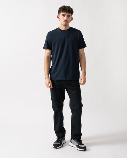 full length shot of a model wearing a Parajumpers Shispare Mens T-Shirt in Blue Navy 316