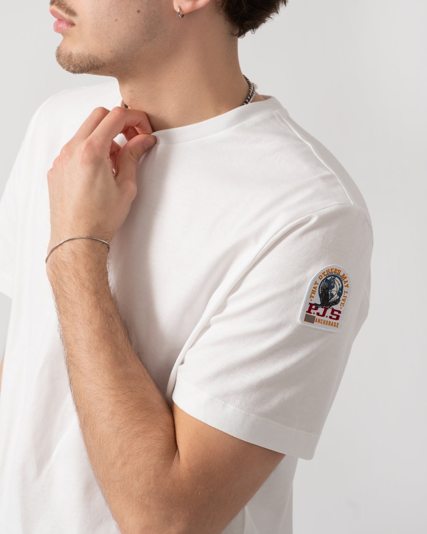 side shot of a model wearing s Parajumpers Shispare Mens T-Shirt in White 501