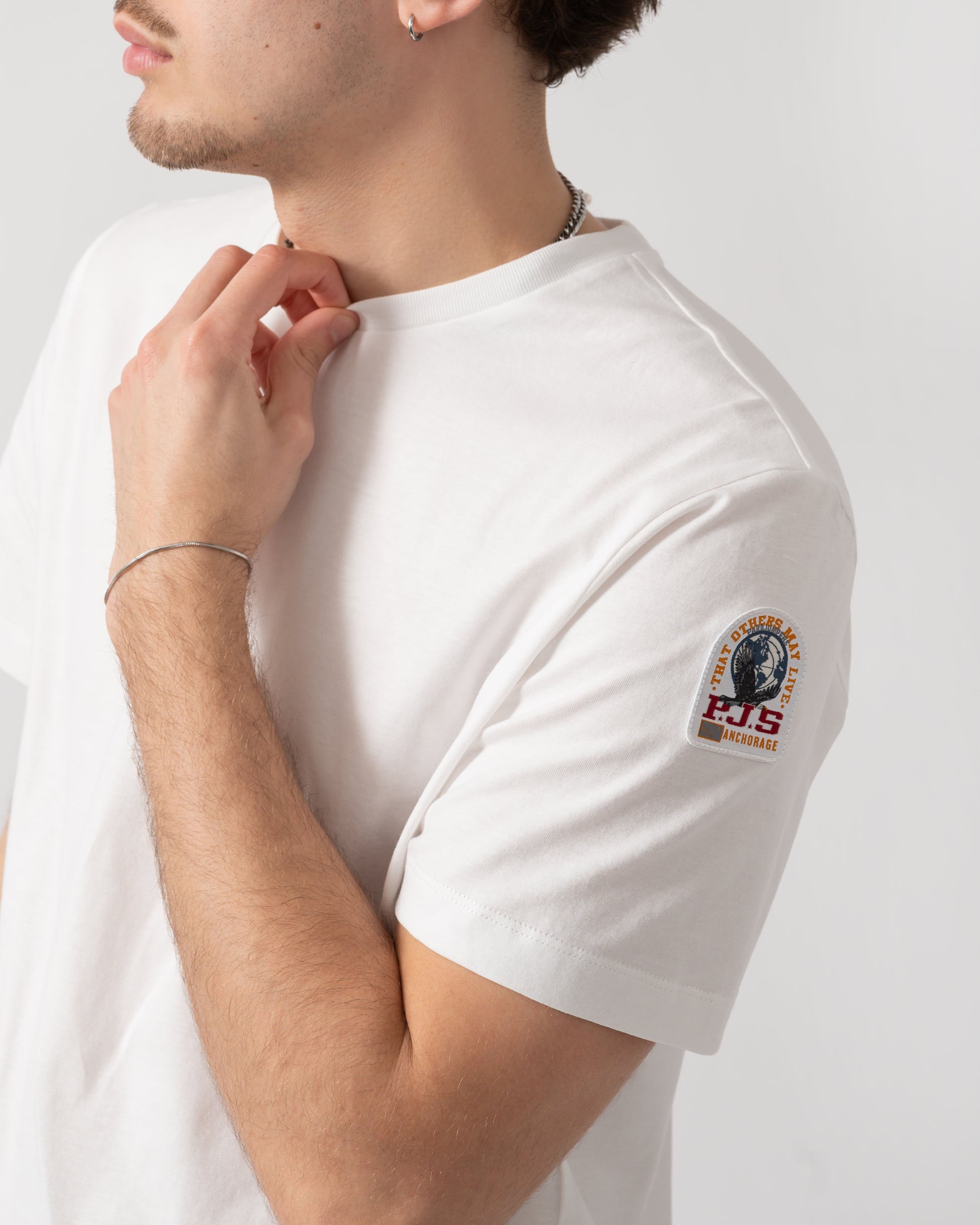side shot of a model wearing s Parajumpers Shispare Mens T-Shirt in White 501