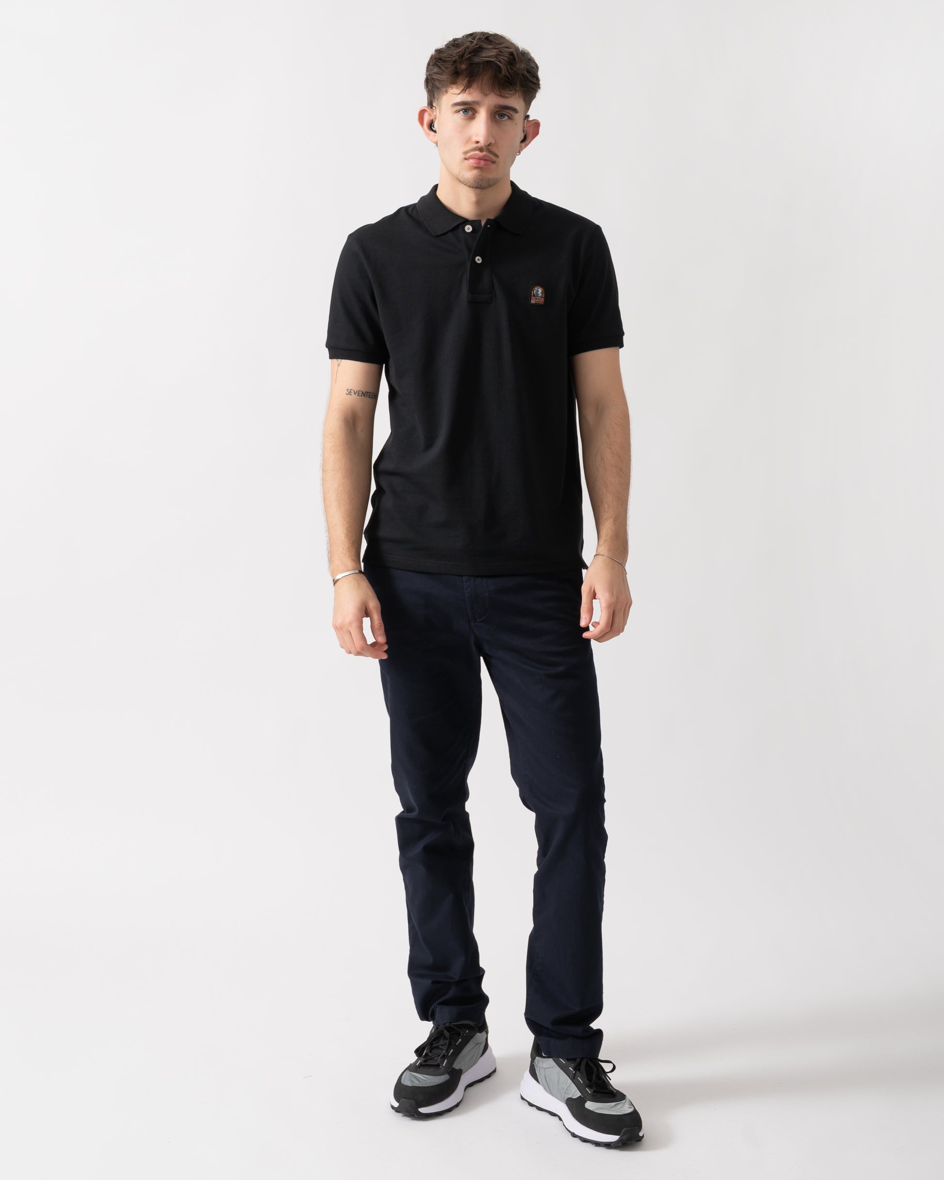 full length shot of a model wearing a Parajumpers Wellington Mens Polo Shirt in Black 541