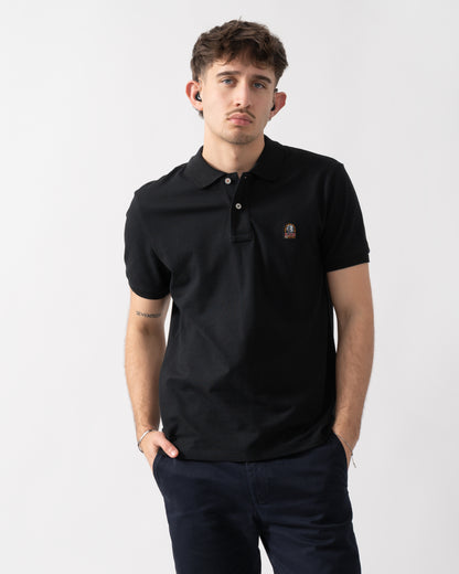 studio shot of a model wearing a Parajumpers Wellington Mens Polo Shirt in Black 541