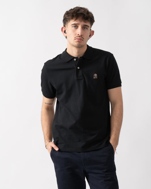 studio shot of a model wearing a Parajumpers Wellington Mens Polo Shirt in Black 541