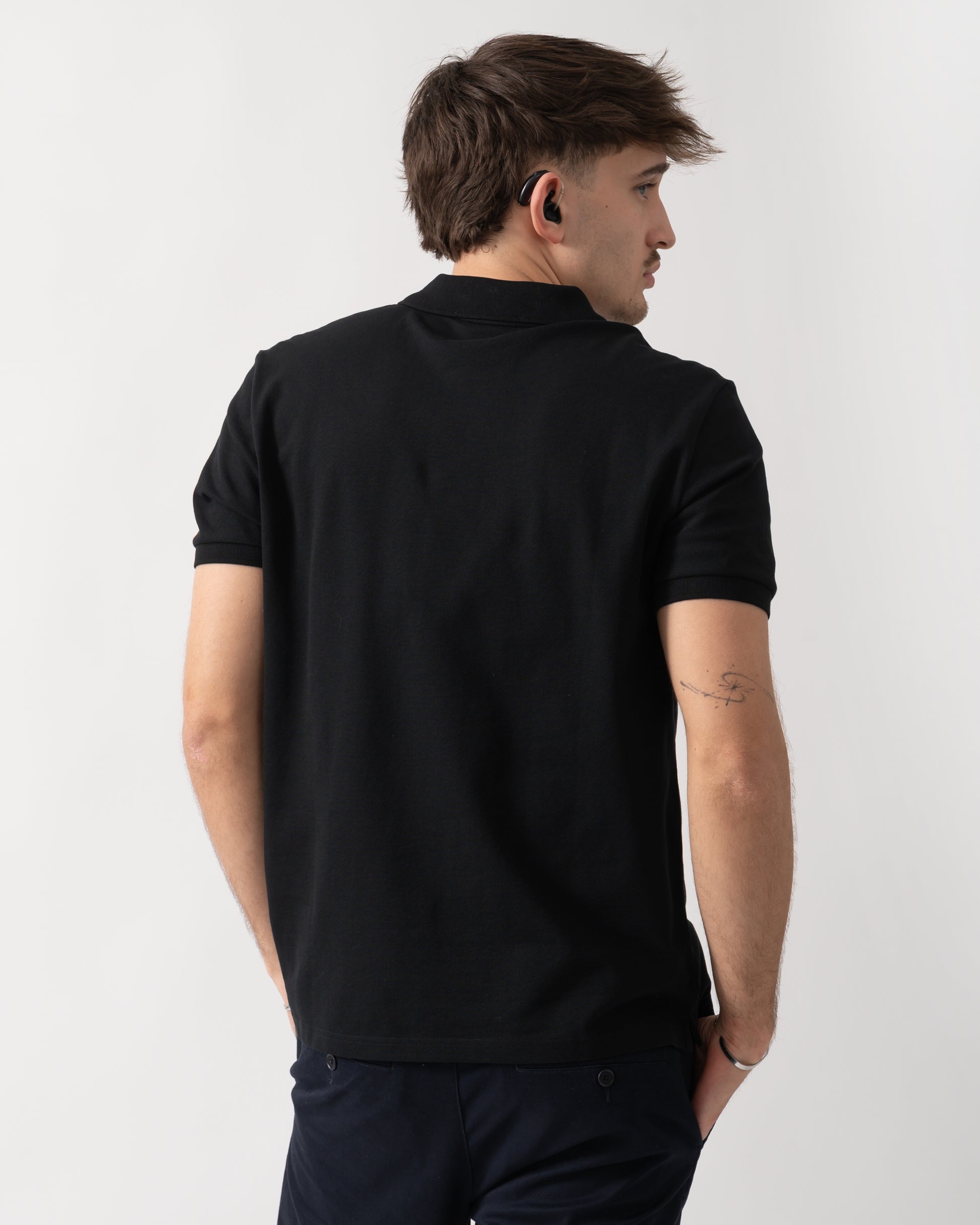 back shot of a model wearing a Parajumpers Wellington Mens Polo Shirt in Black 541