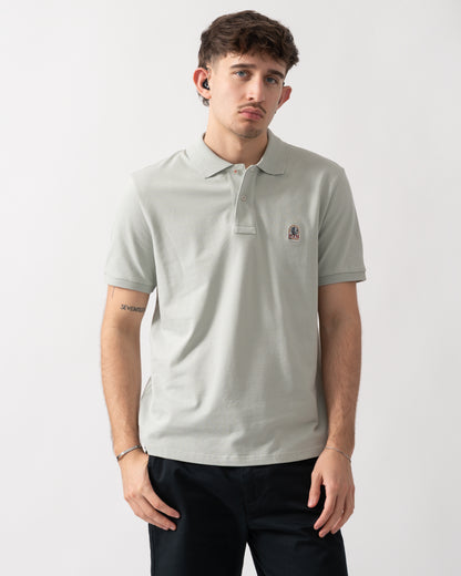 studio shot of a model wearing a Parajumpers Wellington Mens Polo Shirt in Fresh Grey 271