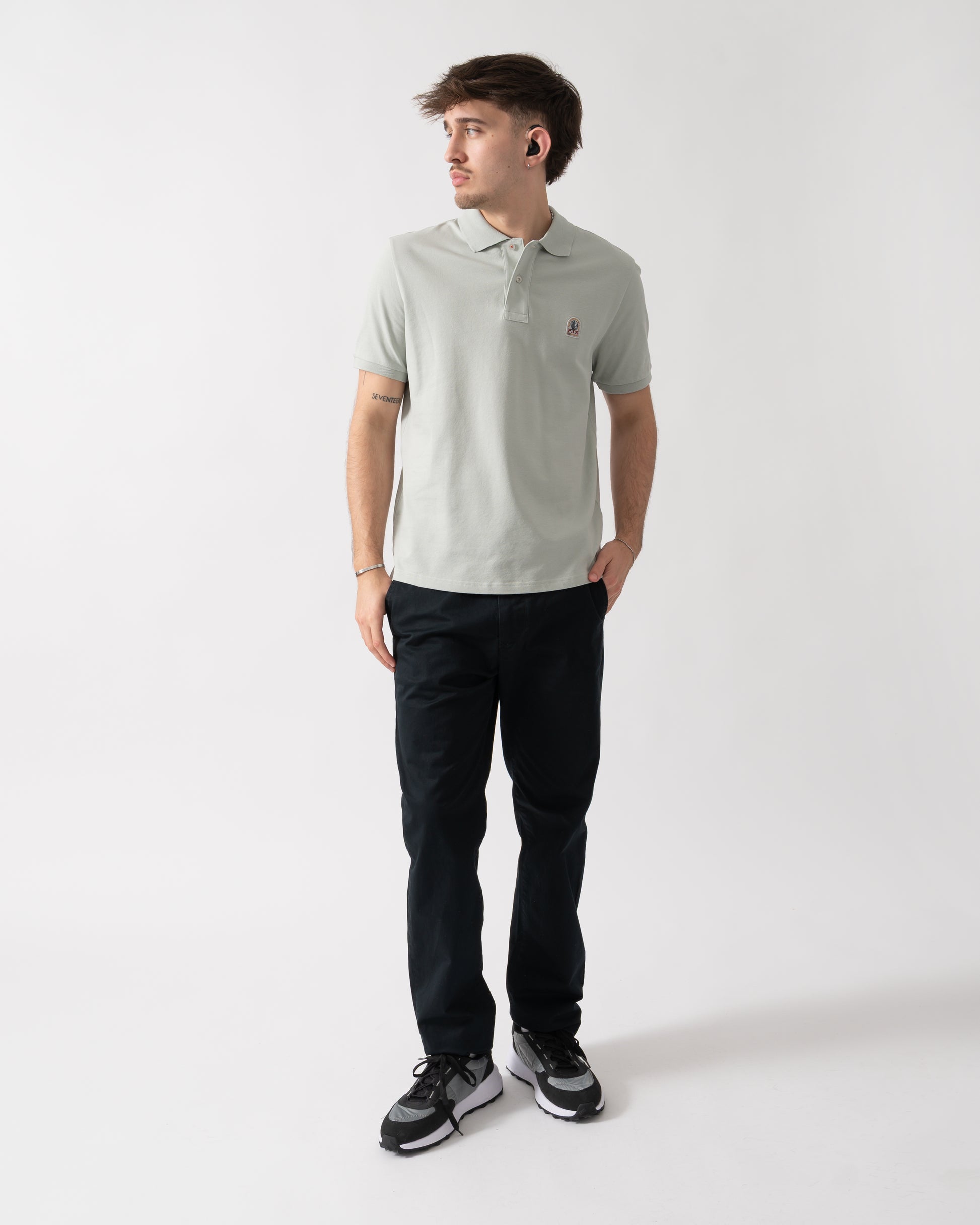 full length shot of a model wearing a Parajumpers Wellington Mens Polo Shirt in Fresh Grey 271