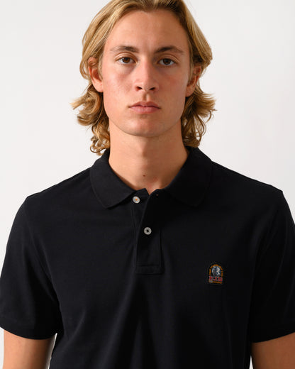 close up of a model wearing Parajumpers Wellington Mens Short Sleeve Polo in Black 541