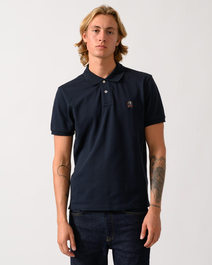model wearing a Parajumpers Wellington Mens Short Sleeve Polo in Blue Navy 316