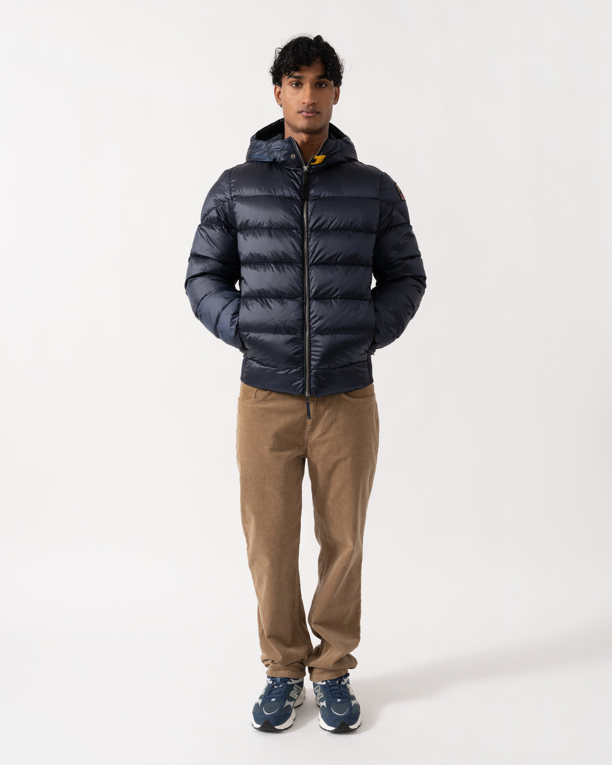 Man wearing the Parajumpers Pharrell Mens Hooded Down Bomber Jacket - Blue Navy 316