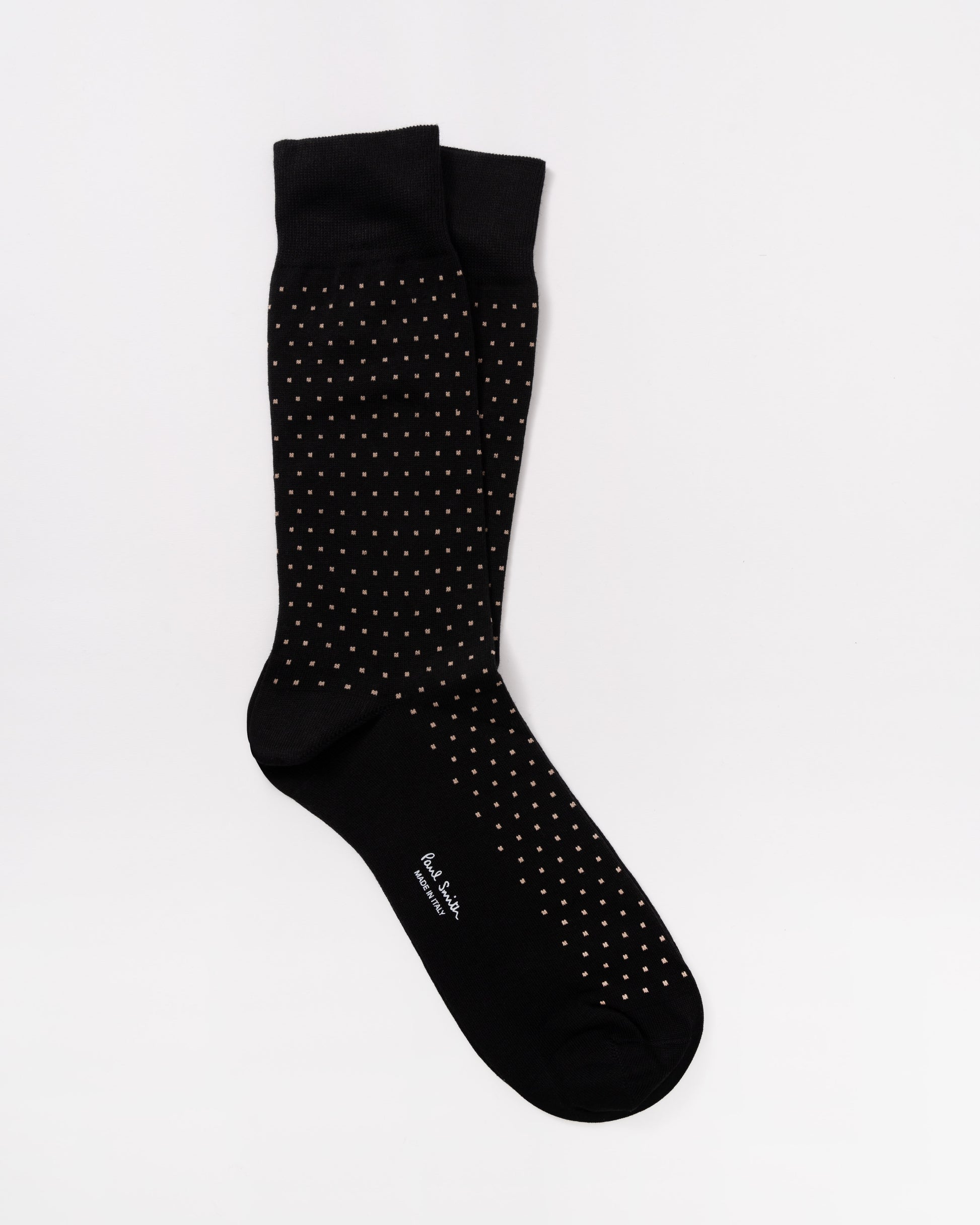 Green sock with pink and white patterns on a white background