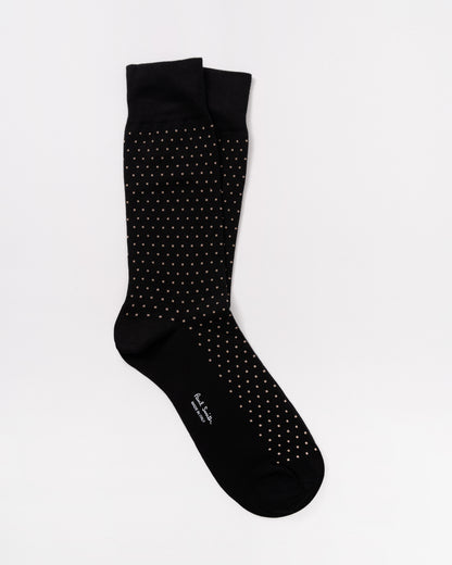 Green sock with pink and white patterns on a white background