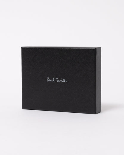 studio photograph showing the packaging of a Paul Smith Mens Zebra Badge Billfold Wallet in 79 Black