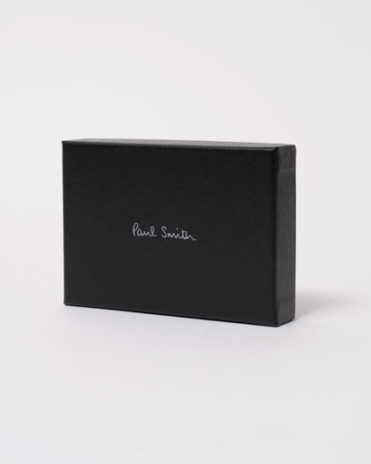 studio photograph showing the packaging of a Paul Smith Mens Zebra Badge Card Holder in 79 Black