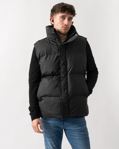 model wearing a Rains Boxy Unisex Puffer Vest