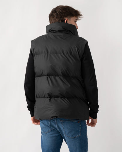 back of model wearing a Rains Boxy Unisex Puffer Vest