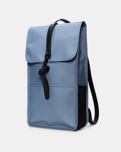 side of a Rains Unisex Backpack in 172 Blue Dusk