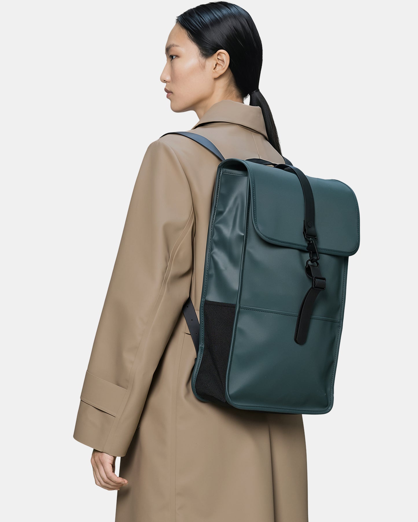 model wearing a Rains Unisex Backpack in 175 Mystique