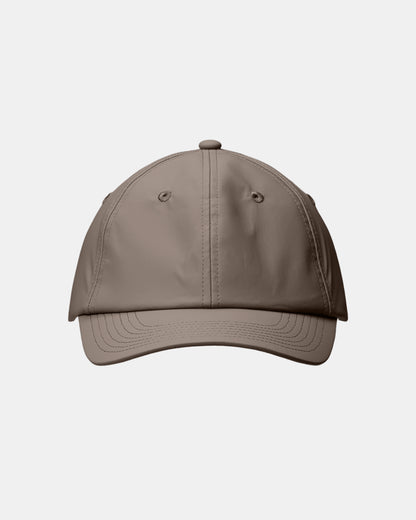 front of a Rains Waterproof Six Panel Cap in 173 Cinder