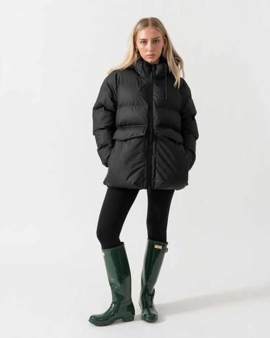 Model wearing the Rains Alta Womens A-Line Puffer Jacket - 01 Black