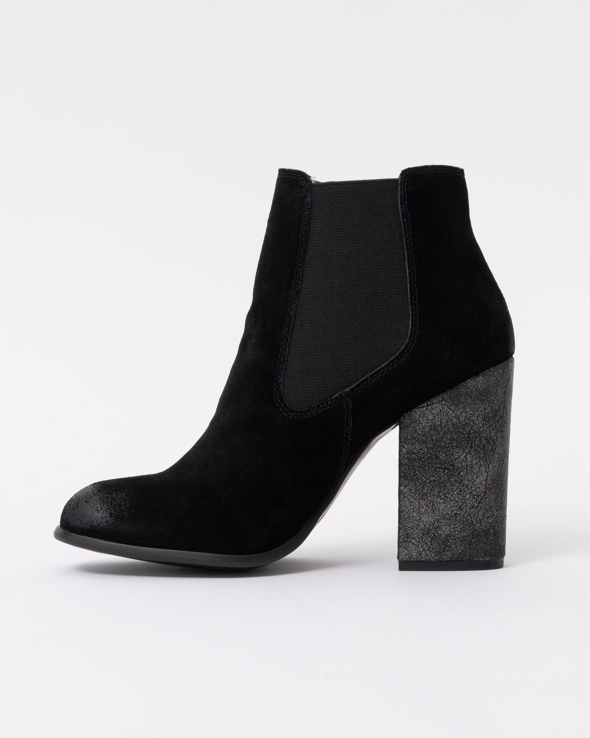 Black ankle boot with a block heel on a white background