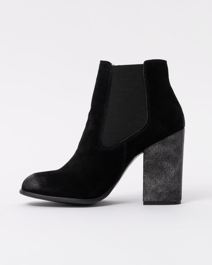 Black ankle boot with a block heel on a white background